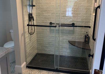 Modern Bathroom Featuring Textured Subway Tile and Geometric Pattern Floor | Newburyport MA Tile Design